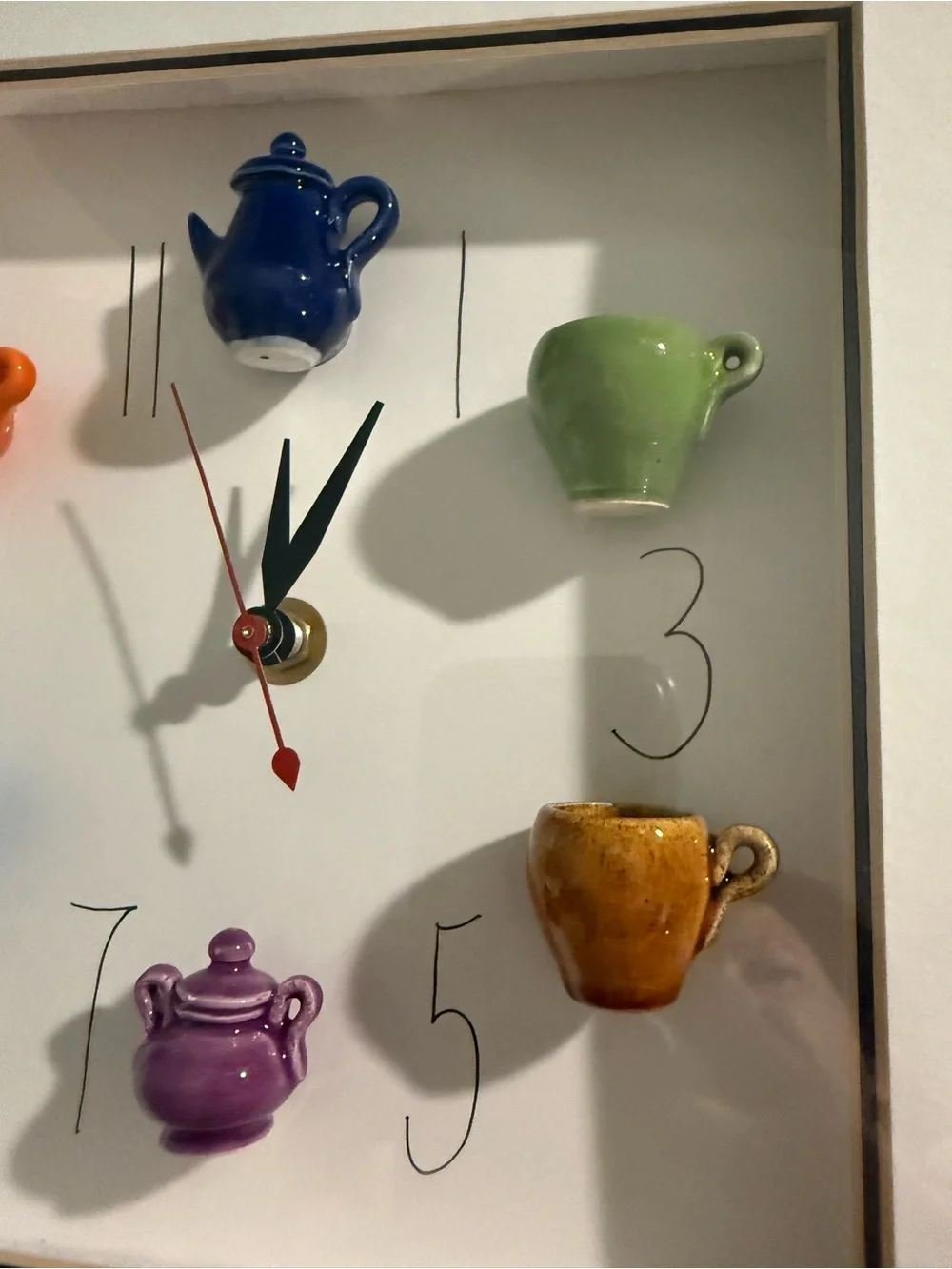 This 10x10 inch shadowbox wall clock, signed by artist Carlos Silva of Centuries